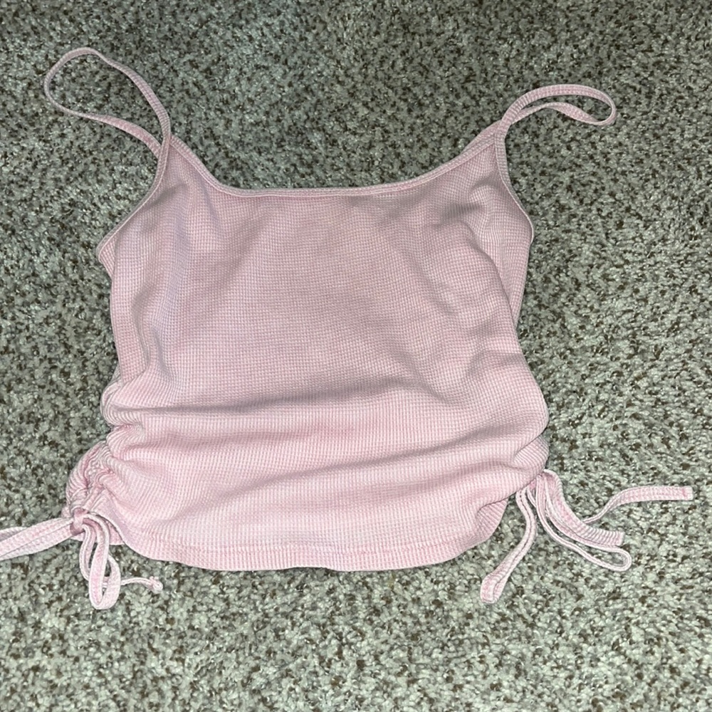 cute pink crop with ties on side. size M